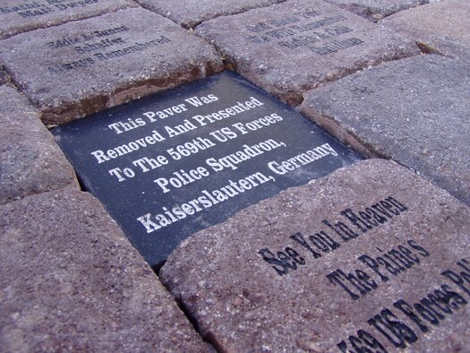 A granite slab rests in place of the “missing paver” at the Erik Hite Memorial in Tucson, Ariz. The paver was delivered to the 569th U.S. Forces Police Squadron, Vogelweh Military Complex, Germany, June 19, 2009. (Courtesy photo)