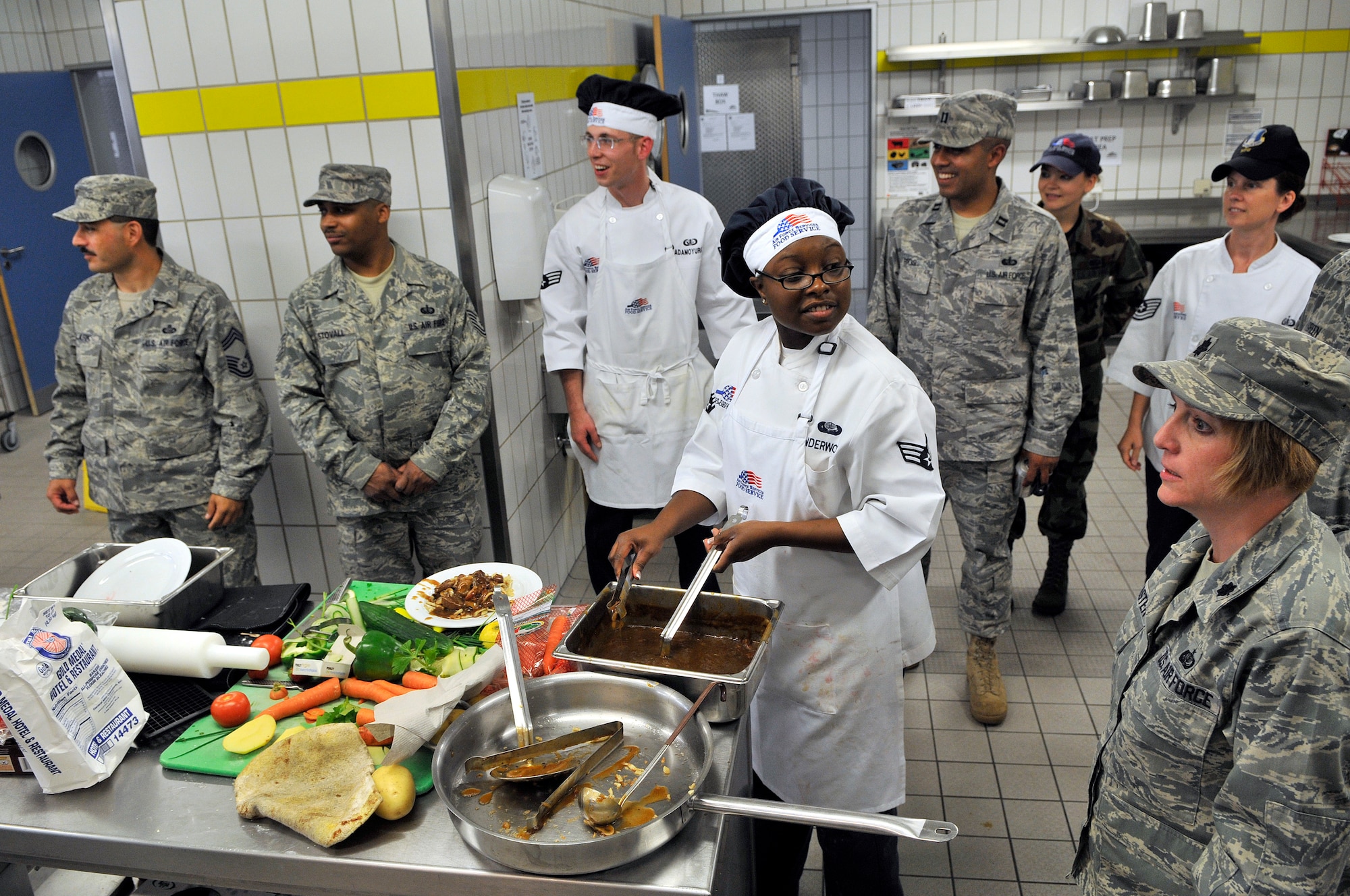 U.S. Air Force airmen from the 435th Services Squadron participate in the second round of the Top Chef Competition at the Lindberg Hof Dining Facility on Kapaun Air Station June 17, 2009. (U.S. Air Force photo by Staff Sgt. Stephen J. Otero)