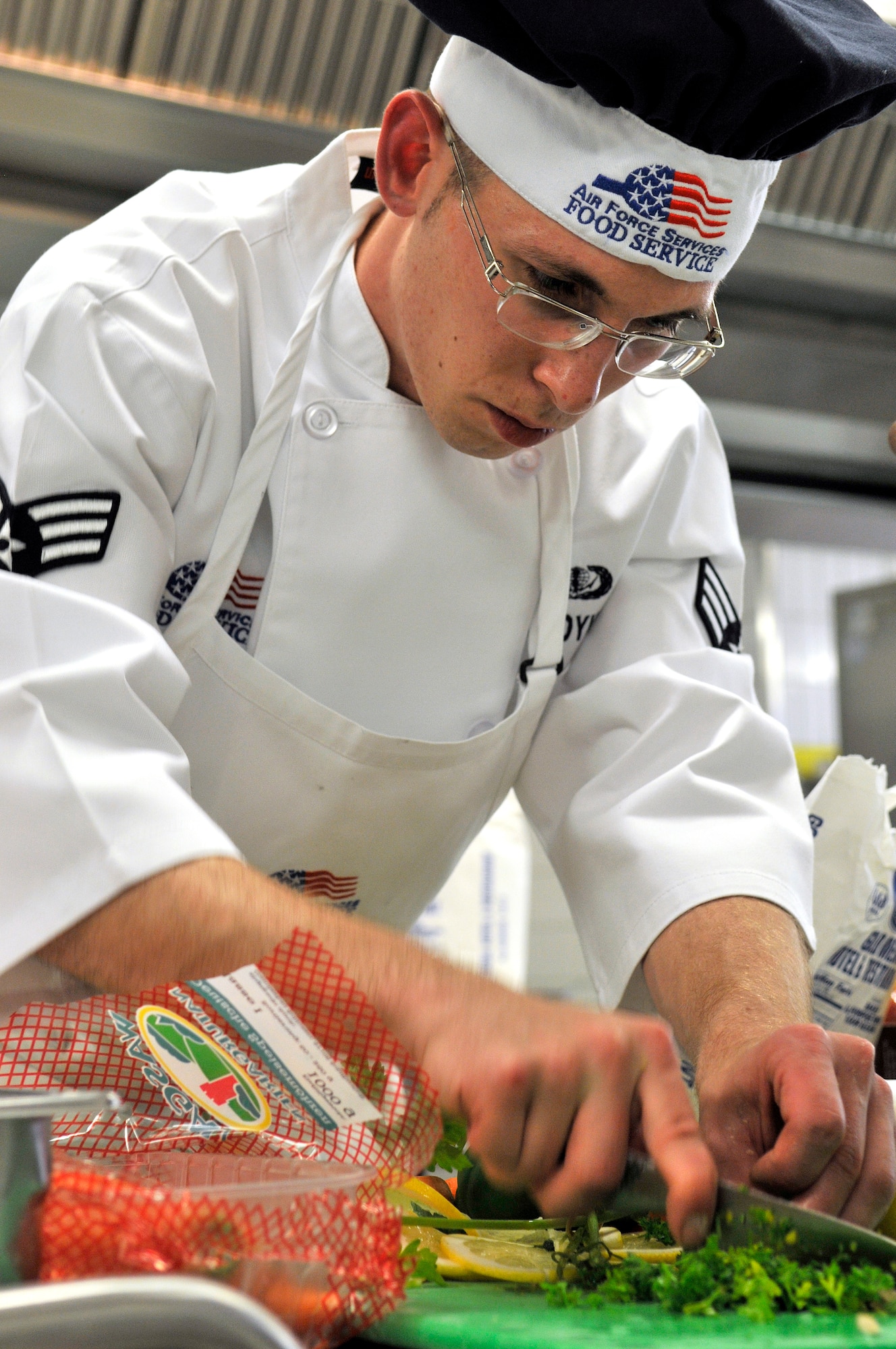 U.S. Air Force Senior Airman Gary Adamoyurka, 435th Services Squadron chef, prepares ingredients during the Top Chef Competition at the Lindberg Hof Dining Facility on Kapaun Air Station June 17, 2009. (U.S. Air Force photo by Staff Sgt. Stephen J. Otero)
