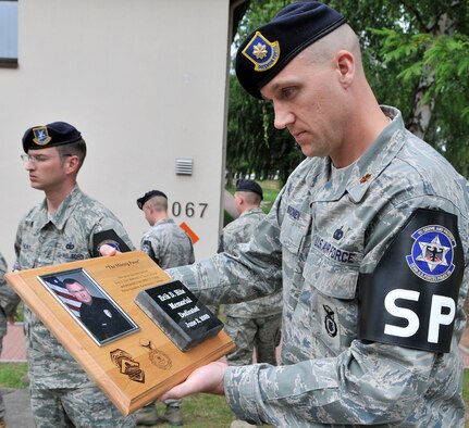 U.S. Air Force Maj. Chris Bromen, 569th U.S. Forces Police Squadron commander, holds a memorial stone created for former Air Force member Erik Hite, Vogelweh Military Complex, Germany, June 19, 2009. Hite was a police officer from Tucson, Ariz., who was killed in the line of duty. (U.S. Air Force photo by Staff Sgt. Stephen J. Otero)