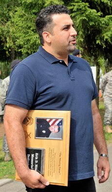 Eddie Schaeffer from Tucson, Ariz., an architect and former 569th U.S. Forces Police Squadron member, flew to Vogelweh Military Complex, Germany, June 19, 2009, to give the squadron a paver from a memorial in Tucson honoring another 569th member, Erik Hite, a Tucson police officer who was injured about a year ago in the line of duty and died a few days later. (U.S. Air Force photo by Staff Sgt. Stephen J. Otero)
