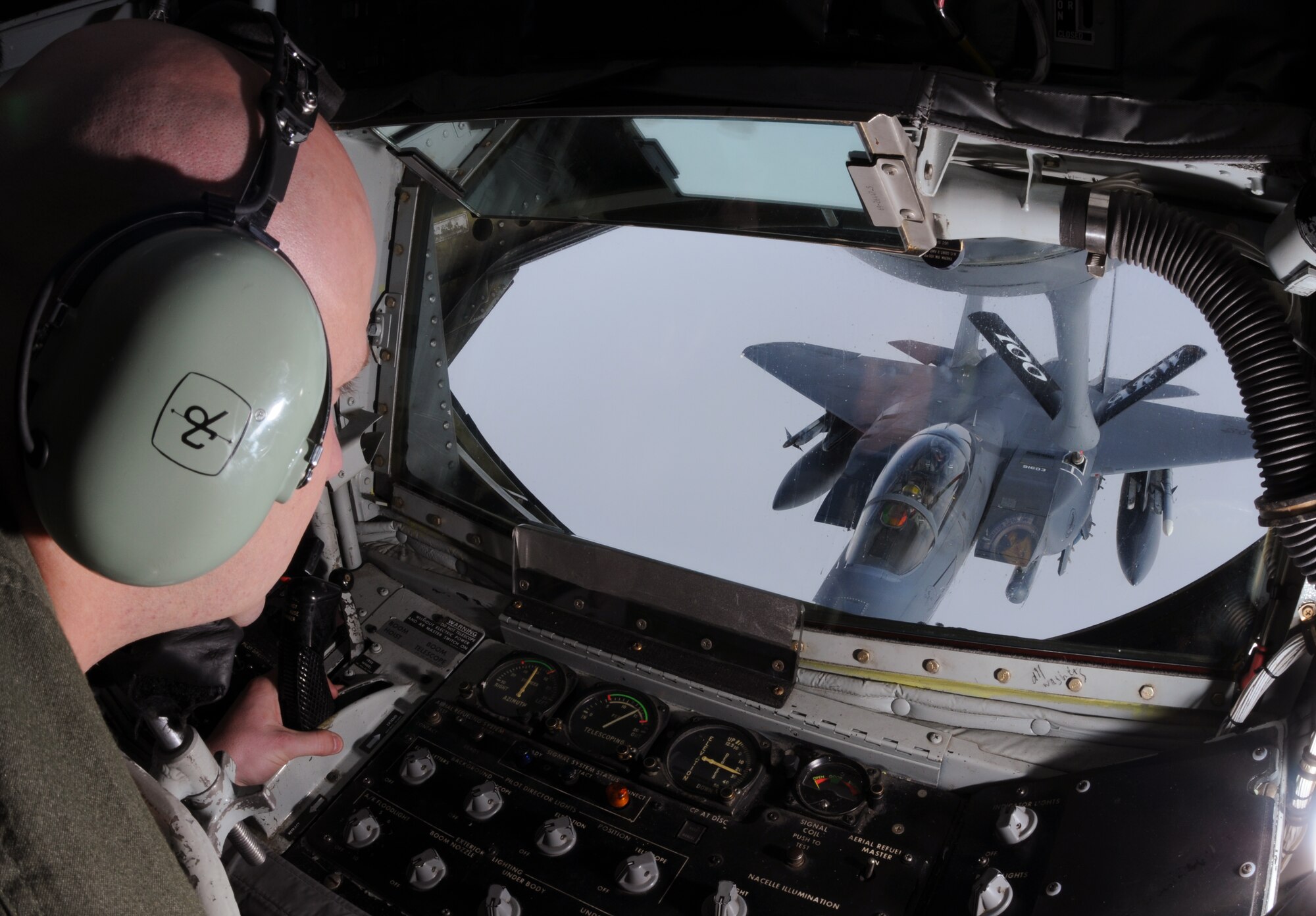 Tech. Sgt. Al Pelletier, 351st Air Refueling Squadron boom operator, transfers fuel from a 100th Air Refueling Wing to an F-15E from the 48th Fighter Wing, RAF Lakenheath, during Loyal Arrow 2009.  The RAF Mildenhall tanker crew flew from Lulea, Sweden, during the ten-day multinational exercise.  (U.S. Air Force photo by Staff Sgt. Austin M. May)