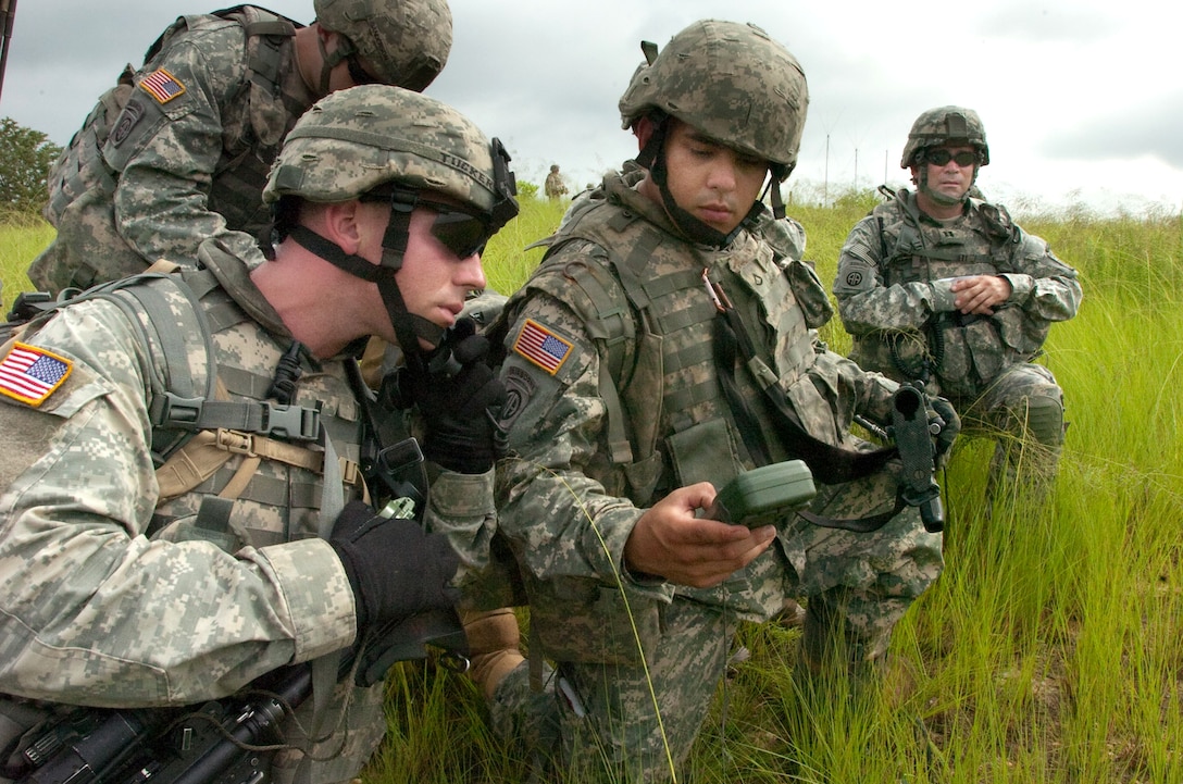 U.S. Army 1st Lt. Trey Tucker, left, platoon leader, determines a grid coordinate with Pvt. 1st Class Alexander Escanlar, right, during the brigade’s Walk and Shoot. The live-fire exercise trains platoon leaders and forward observers of the brigade’s maneuver battalions on an artillery range on Fort Bragg, N.C. It ran June 9 thru 11, 2009. The soldiers are assigned to the 82d Airborne Division's A Troop, 3rd Squadron, 73rd Cavalry Regiment, 1st Brigade Combat Team.