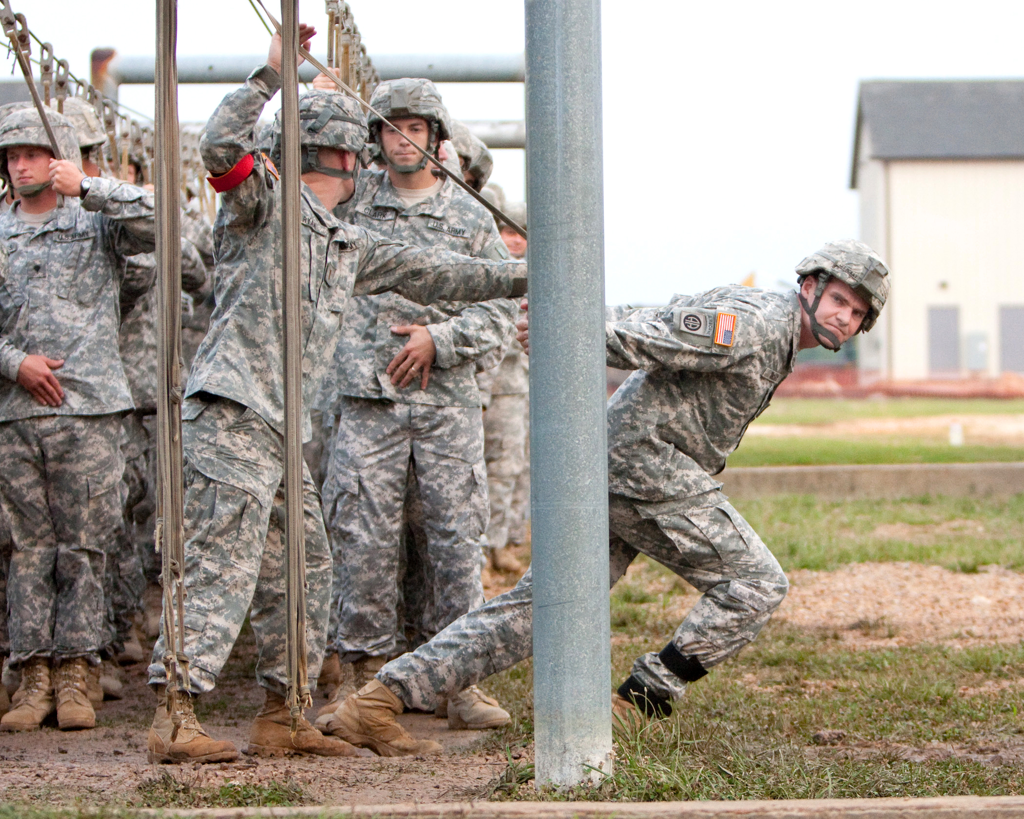 U.S. Army Capt. Scott McKay, a jumpmaster, checks the exit door of an
