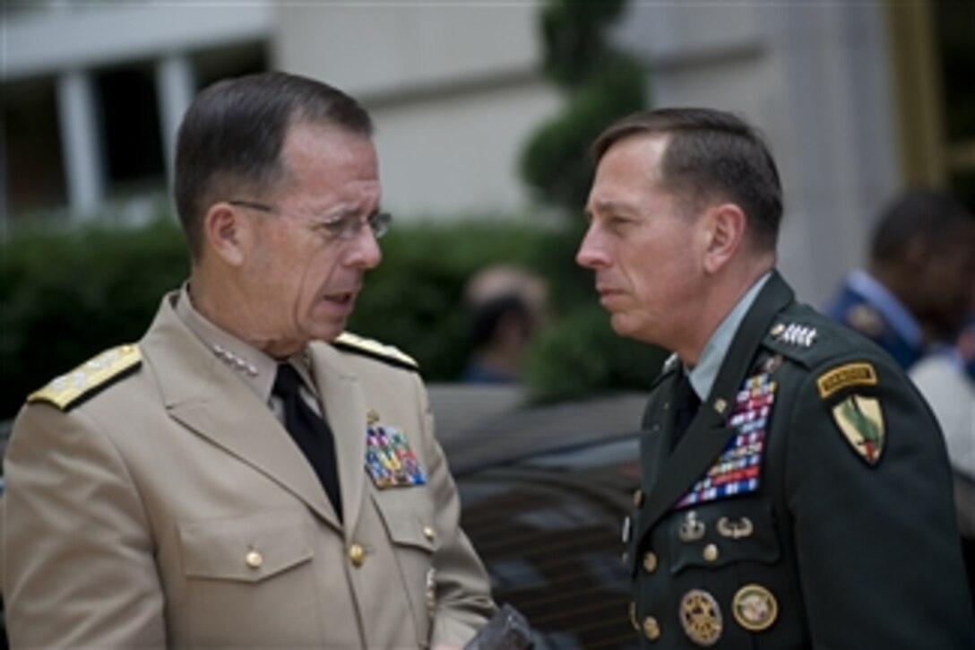Chairman of the Joint Chiefs of Staff Adm. Mike Mullen, U.S. Navy, speaks with Commander, U.S. Central Command Gen. David Petraeus, U.S. Army, at the 2nd Annual Gulf Coast States Chiefs of Defense Conference, at the Fairfax Hotel, Washington, D.C., on June 22, 2009.  The conference, hosted by the Central Command, brings together senior defense officials to foster regional military-to-military cooperation and increase high-level dialogue.  
