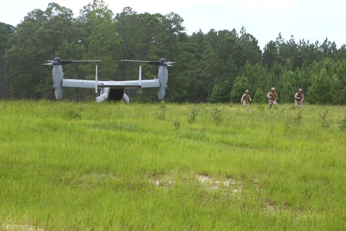 The V-22 Osprey lands as students belonging to the Career Orientation Training for Midshipmen program, prepare to board the aircraft. This is part of their training week aboard Camp Lejeune. Every summer the program brings groups of Naval Reserve Officers Training Corps students from colleges and universities all over the U.S. to Camp Lejeune to conduct Marine Week. CORTRAMID is an introduction for midshipmen to what the Marine Corps and the Navy have to offer the future officers. During the week they are aboard Lejeune, they participate in a variety of training activities from patrolling, live-fire exercises, flying in a military aircraft and learning about an array of military weapons systems.