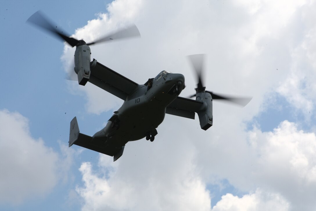 The V-22 Osprey lands as students belonging to the Career Orientation Training for Midshipmen program, prepare to board the aircraft. This is part of their training week aboard Camp Lejeune. Every summer the program brings groups of Naval Reserve Officers Training Corps students from colleges and universities all over the U.S. to Camp Lejeune to conduct Marine Week. CORTRAMID is an introduction for midshipmen to what the Marine Corps and the Navy have to offer the future officers. During the week they are aboard Lejeune, they participate in a variety of training activities from patrolling, live-fire exercises, flying in a military aircraft and learning about an array of military weapons systems.