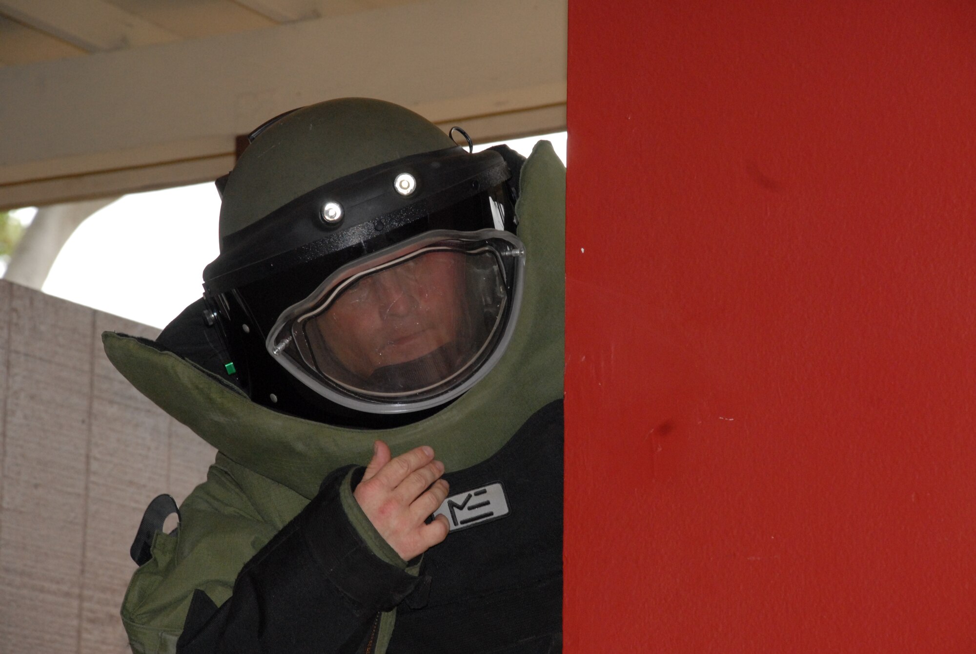 HICKAM AIR FORCE BASE, Hawaii – Tech. Sgt. Denny Hart, 15th Civil Engineer Squadron explosive ordnance disposal technician, enters a booby-trapped house on base looking for improvised explosives June 22. This regular training prepares EOD techs for situations they face overseas. The EOD career field was named Air Force Team of the Year for the first time in 2009 for clearing more roadside bombs than any other service in Iraq and Afghanistan - 1,915, according to Air Force officials. (U.S. Air Force photo/Senior Airman Carolyn Viss)