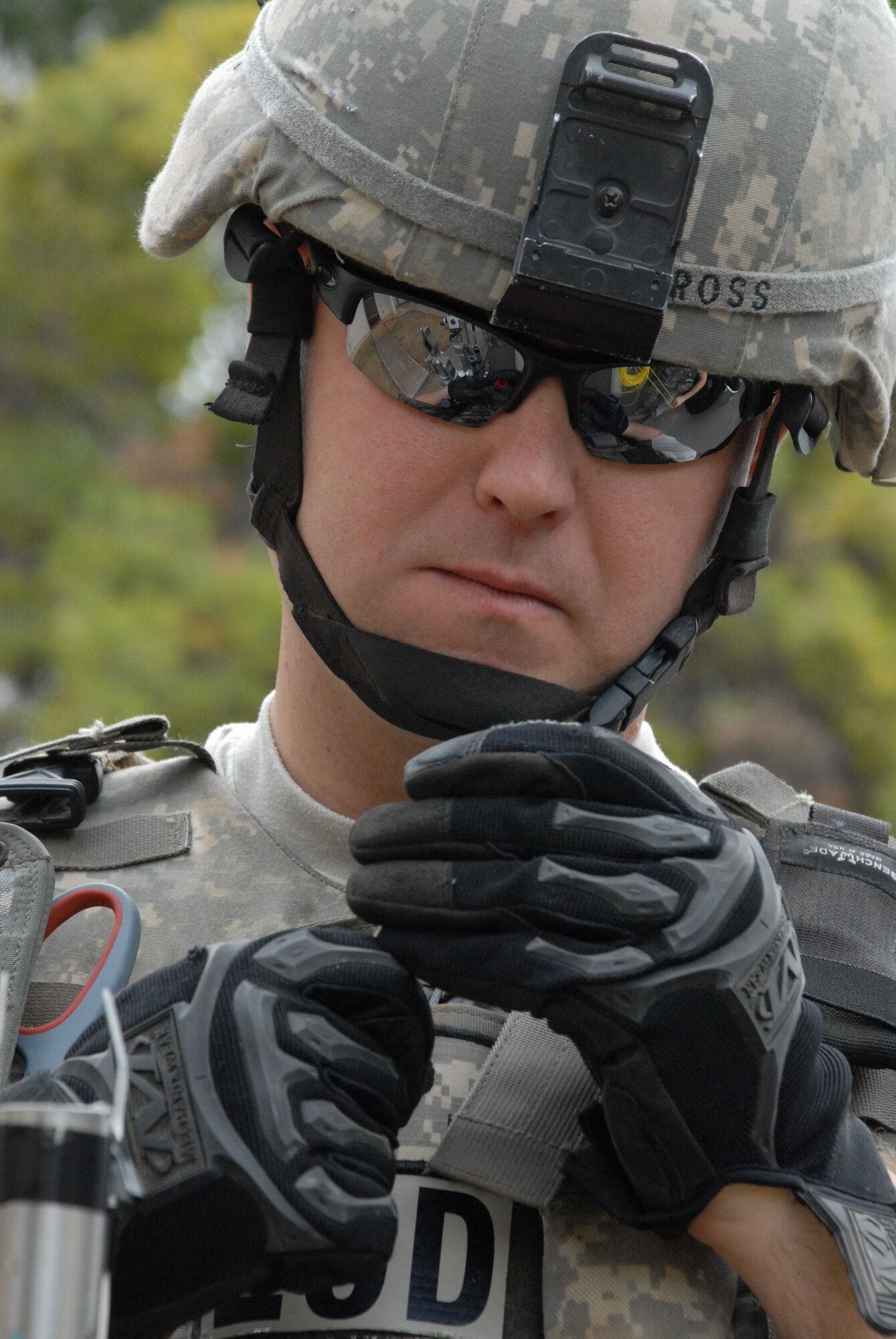 HICKAM AIR FORCE BASE, Hawaii – Staff Sgt. Zachary Ross wires an explosive device to rig an unoccupied home on base as part of regular training here June 22. As a 15th Civil Engineer Squadron explosive ordnance disposal technician, his job is to respond to improvised explosive devices or unexploded ordnance both stateside and overseas. The EOD career field was named Air Force Team of the Year for the first time in 2009 for clearing more roadside bombs than any other service in Iraq and Afghanistan - 1,915, according to Air Force officials.  (U.S. Air Force photo/Senior Airman Carolyn Viss)
