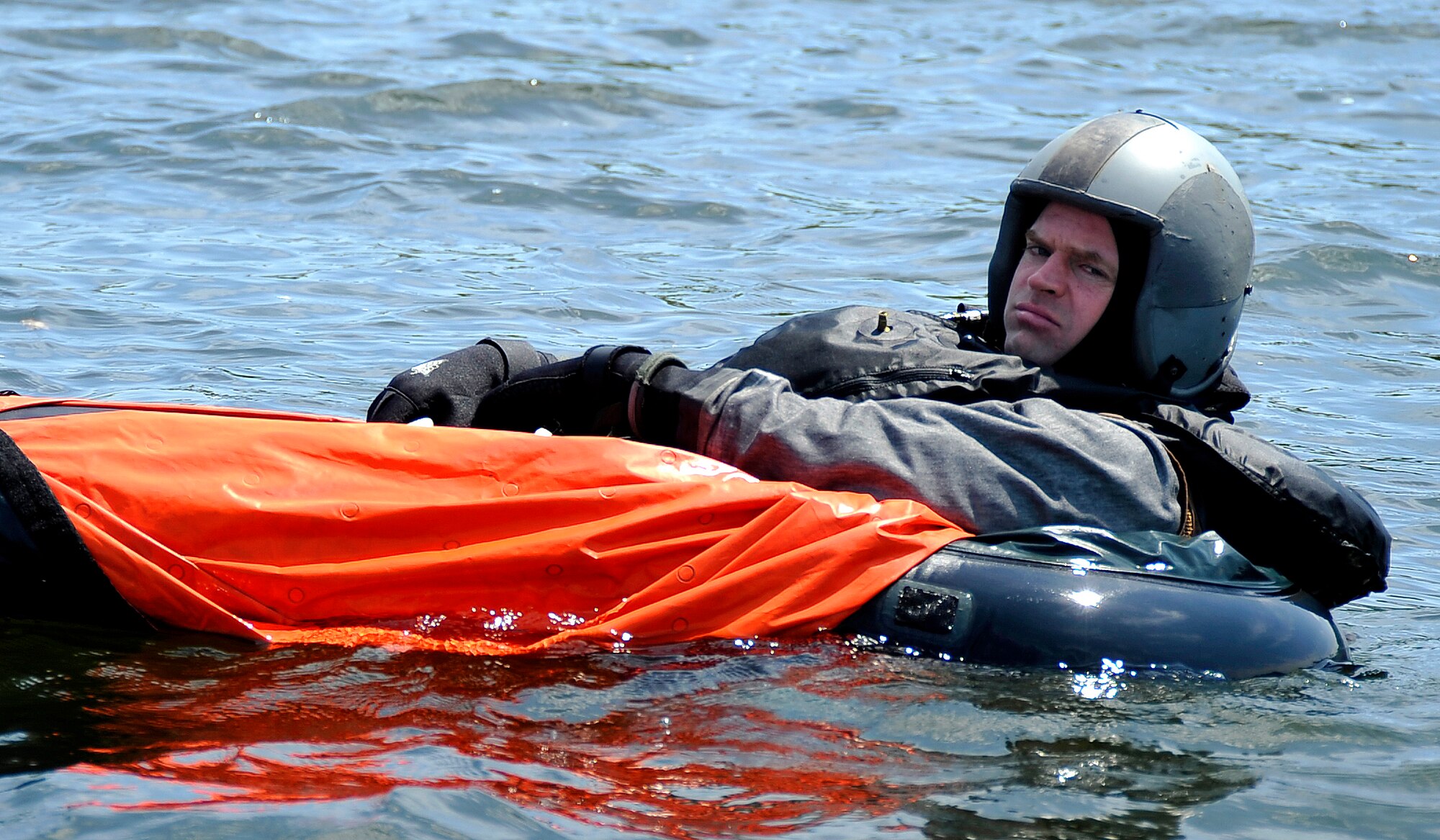 MISAWA AIR BASE, Japan -- Maj. Wesley Hales, 13th Fighter Squadron pilot, awaits rescue during water survival training at Lake Ogawara June 24, 2009.  Water survival training is taught by Survival, Evasion, Resistance and Escape specialists annually. (U.S. Air Force photo by Senior Airman Chad C. Strohmeyer)