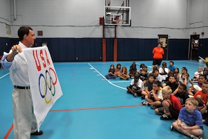 Former Olympian Carlton Bruner speaks about fitness and sportsmanship to a group of kids at the Charleston AFB youth center June 23. Mr. Bruner was also promoting the potential for the Olympics to be held in Chicago in 2016. From 1992 through 1996, Bruner was considered one of the top swimmers in the world in both the 800-meter and 1500-meter freestyle events. (U.S. Air Force photo/James M. Bowman)
