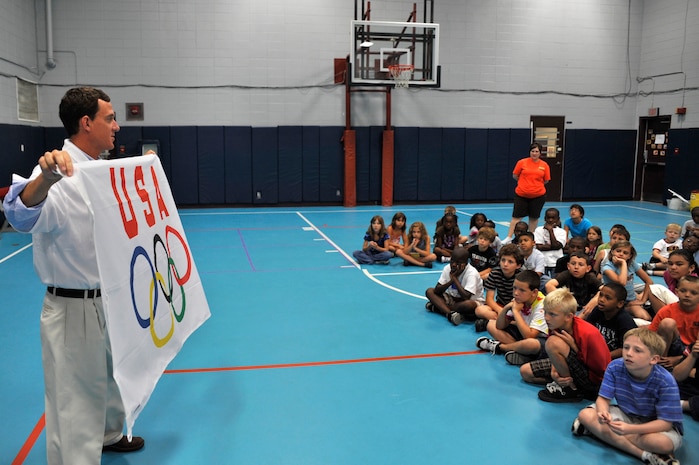 Former Olympian Carlton Bruner speaks about fitness and sportsmanship to a group of kids at the Charleston AFB youth center June 23. Mr. Bruner was also promoting the potential for the Olympics to be held in Chicago in 2016. From 1992 through 1996, Bruner was considered one of the top swimmers in the world in both the 800-meter and 1500-meter freestyle events. (U.S. Air Force photo/James M. Bowman)
