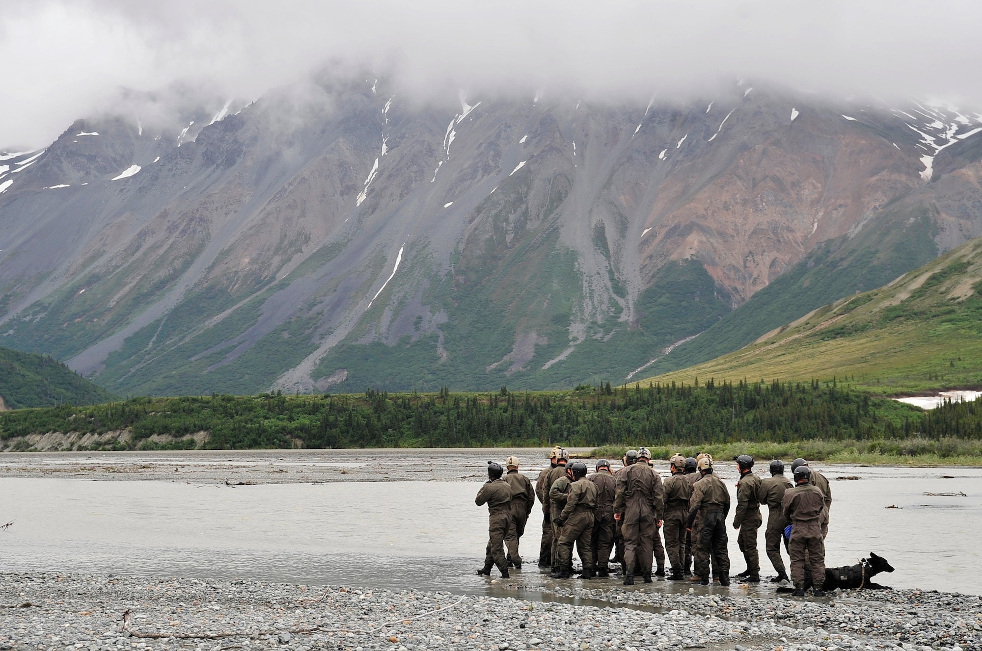 A group of Navy SEALs prepare to cross Phelan Creek during Northern Edge 2009 June 17 at Fort Wainwright, Alaska. Northern Edge is a large-scale exercise hosted in Alaska to improve command, control and communications between the armed services. The Northern Warfare Training Center and the SEALs worked together on river crossing techniques and rope handling. (U.S. Air Force photo/Staff Sgt. Christopher Boitz)