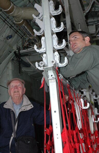 Maj. Jeff Phillips (right) shows William "Bill" Hix Poole the ins and outs of a 302nd Airlift Wing Air Force Reserve C-130 "Hercules" May 4 during a visit to Peterson Air Force Base, Colo. Mr. Poole, a B-25 bomber pilot assigned to the 310th Bombardment Group during World War II, was escorted throughout the base to get an up-close look at the mission of the 310th Space Wing and its subordinate units. Mr. Poole saw combat in the skies above both North Africa and Italy, and had flown 73 combat missions by the age of 20. The 310th SW, an AF Reserve wing, was reactivated recently, taking on the famed namesake of the 310th BW. Major Phillips is a pilot with the 731st Airlift Squadron. (U.S. Air Force photo/Senior Airman Stephen J. Collier)