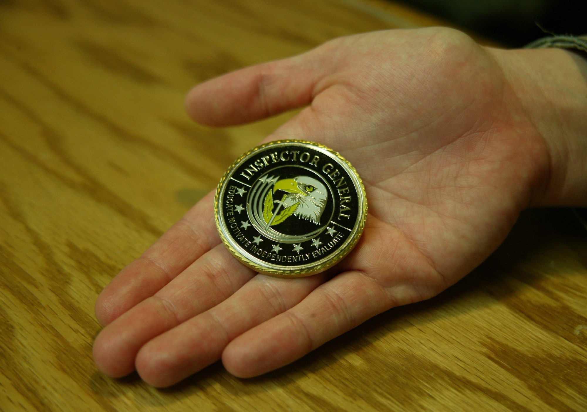 SHAW AIR FORCE BASE, S.C. -- Senior Airman Mary Wheeler, 79th Fighter Squadron, displays the inspector general coin she was awarded during Shaw's 2009 Operational Readiness Inspection. (U.S. Air Force photo/Tech. Sgt. Vincent Mouzon)