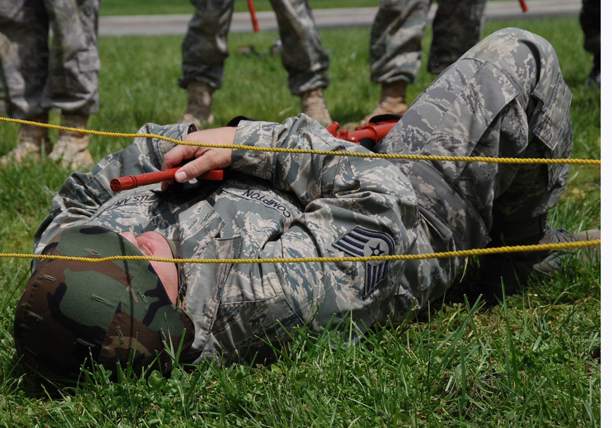 A 932nd Airlift Wing civil engineer slowly goes under a yellow rope obstacle during the unit drill training at Scott Air Force Base.  The wing comes together again each core weekend to learn mission essential tasks and to stay sharp physically and mentally.  (U.S. Air Force photo/Tech. Sgt. Dan Oliver)