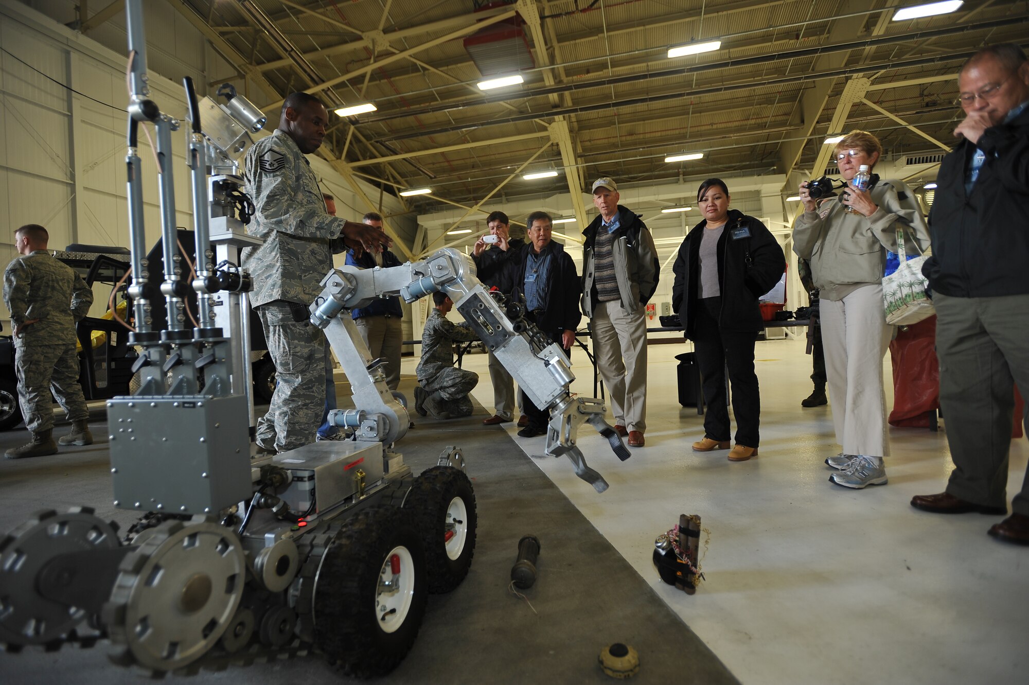 ELMENDORF AIR FORCE BASE, Alaska -- During the civic leaders tour June 23, Master Sgt. Gerald Davis briefs the group on the capabilities of the 3rd Civil Engineer Squadron Explosive Ordnance Disposal robot that is used to conduct remote procedures on any items that may contain explosive components. Davis is a member of the 3rd Civil Engineer Squadron. (U.S. Air Force photo/Senior Airman Tinese Treadwell)
