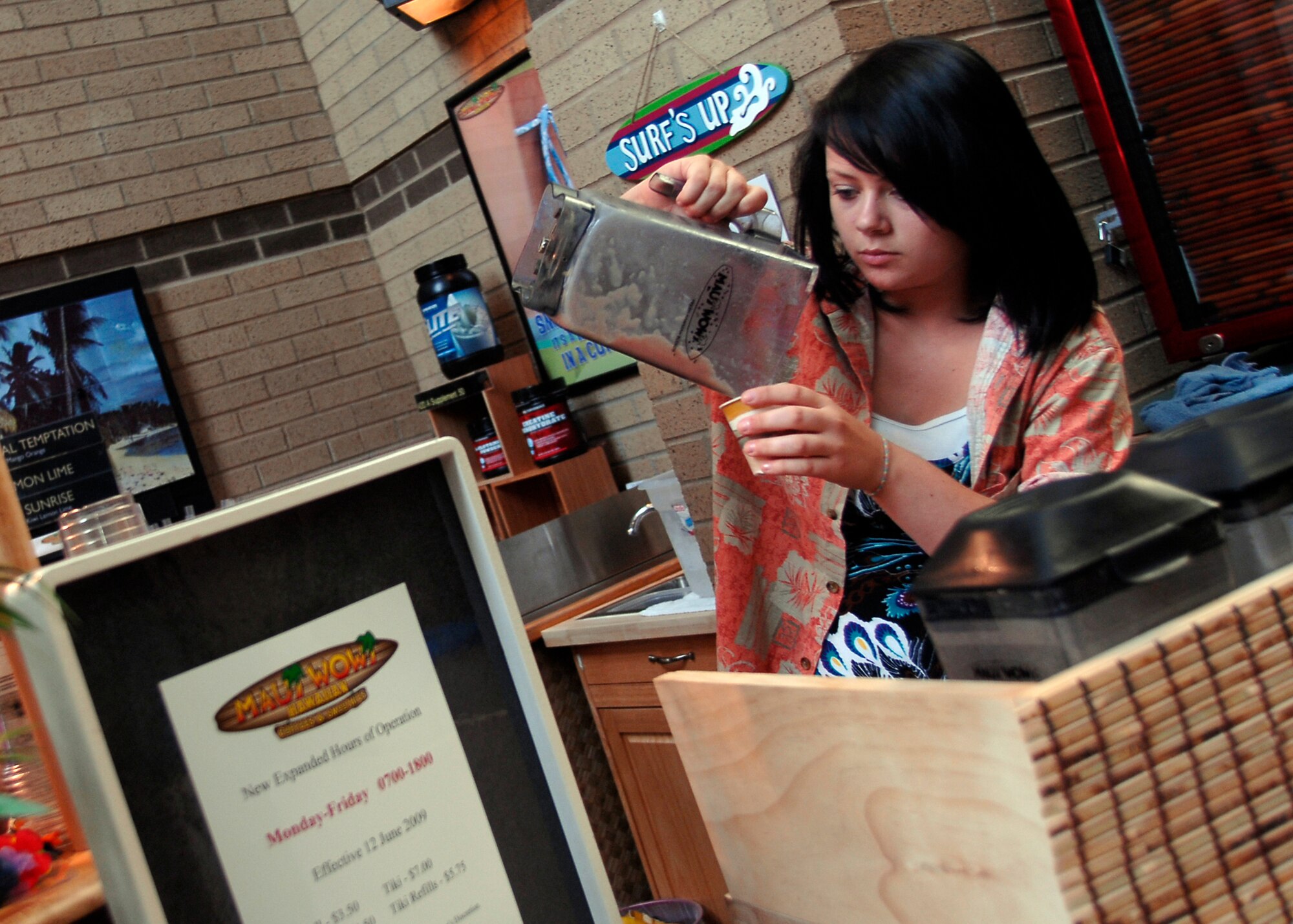MCCONNELL AIR FORCE BASE, Kan. -- Crystal Jacobs makes a smoothie at the Maui Wowi Smoothie/Coffee shop in the Robert J. Dole community center, June 19. The Maui Wowi, is located just outside the entrance to the gym and offers a wide selection of cold non-alcoholic beverages.  (Photo by Senior Airman Anthony Mejia)
