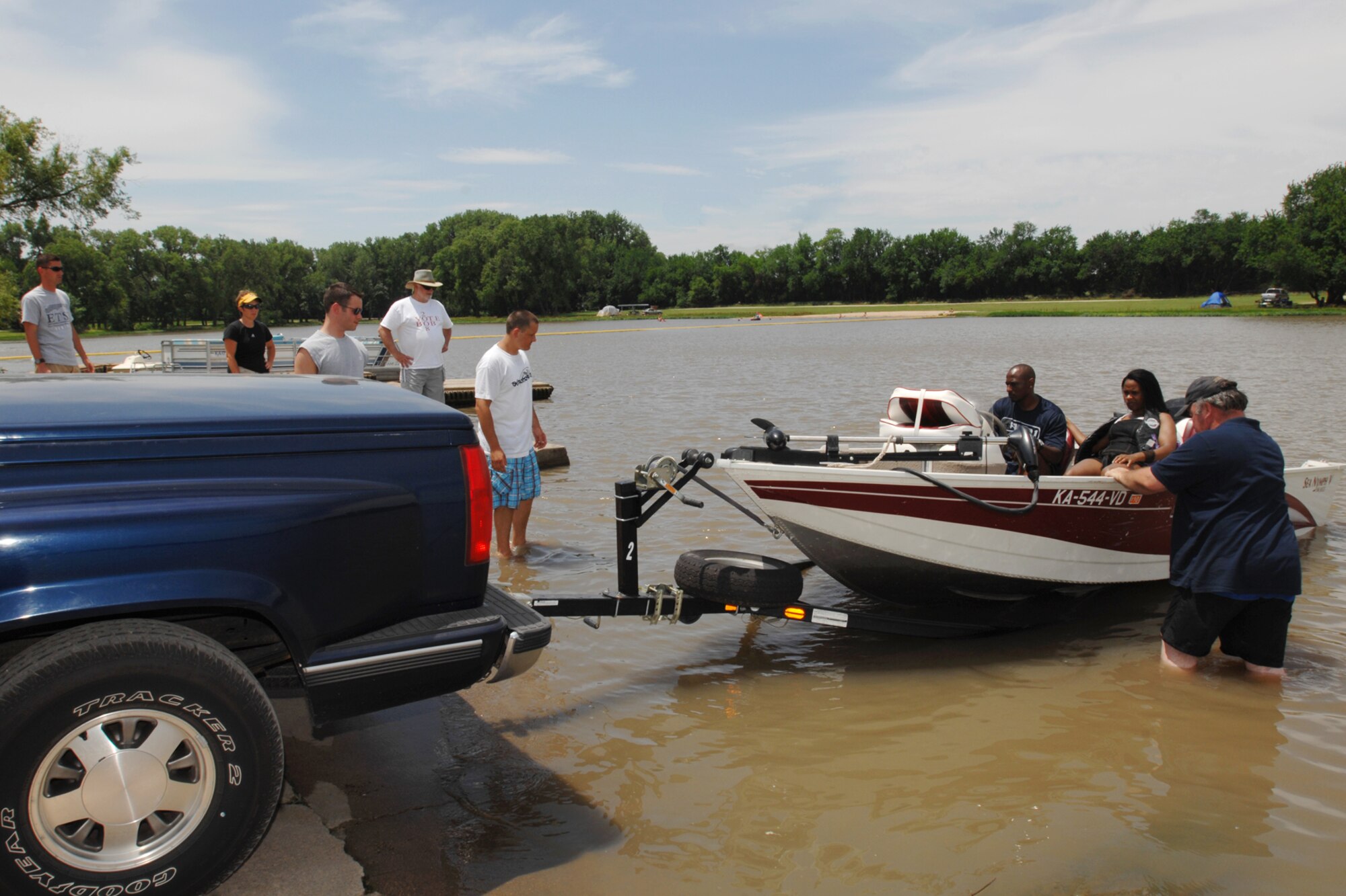 MCCONNELL AIR FORCE BASE, Kan.-- Members of Team McConnell look on as Rick Grenier, maintenance manager for McConnell outdoor recreation, shows how to dock a boat during the boater’s safety course at Santa Fe Lake in Augusta, Kan., June 18. Members must attend this course before renting boating equipment from the outdoor recreation office. (Photo by Staff Sgt. Jamie Train)