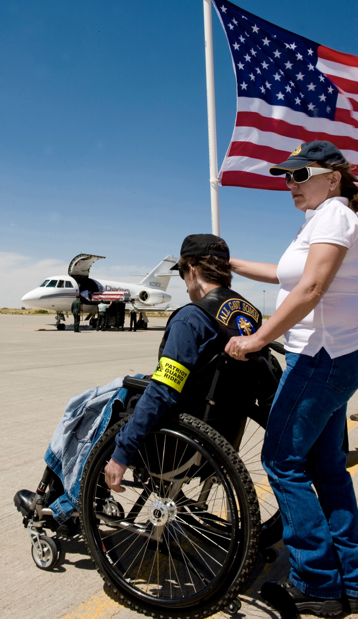 A member of the Patriot Guard Riders pays his final respects June 11 as the casket of fallen Army Spc. Christopher M. Kurth arrives at Holloman Air Force Base, N.M. The Soldier was killed in a grenade attack June 4 near Kirkuk, Iraq. Specialist Kurth was a native of Alamogordo, N.M., and was stationed at Fort Hood, Texas. (U.S. Air Force photo/Tech. Sgt. Alan Port) 
