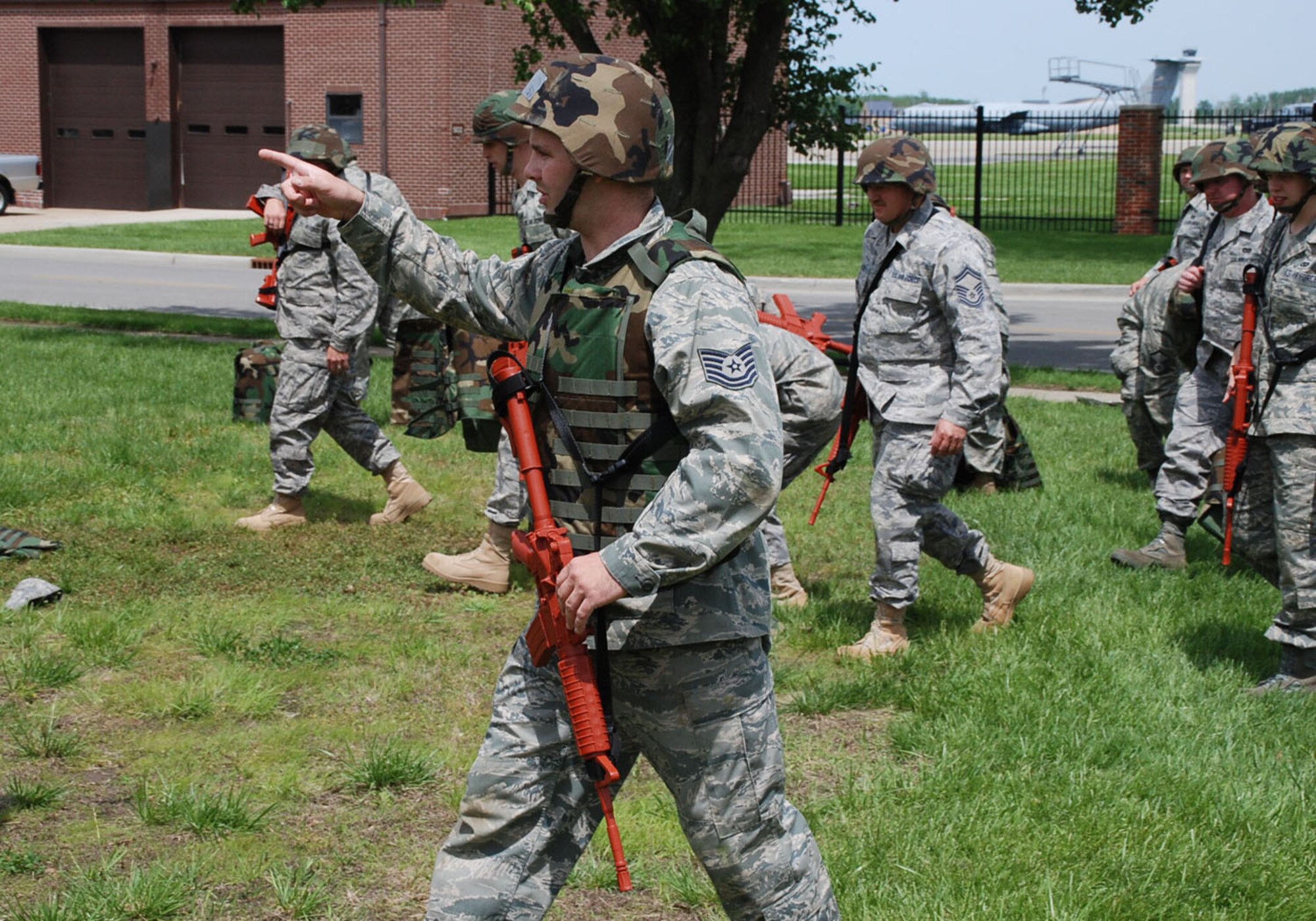 A 932nd Airlift Wing civil engineer gives the command to move forward during the unit drill training at Scott Air Force Base.  Civil engineers do a wide variety of jobs including electrical, plumbing, bulldozing, carpentry and construction projects.  (U.S. Air Force photo/Tech. Sgt. Dan Oliver)