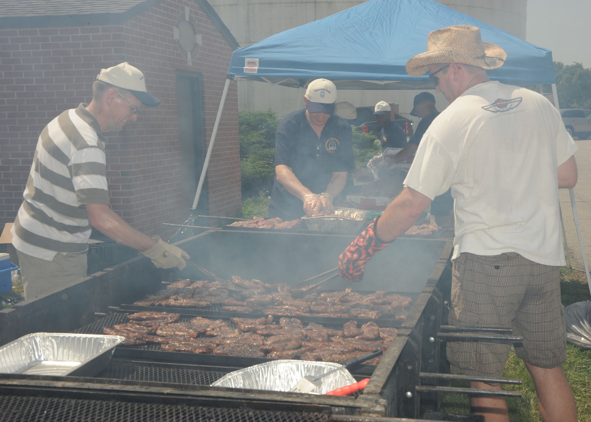 SCOTT AIR FORCE BASE, Ill -- The Scott Chief’s Group held their annual steak lunch June 18 in front of the Air Mobility Command Passenger Terminal. The sold-out lunch consisted of steak, a baked potato, corn on the cob, a dinner roll and a beverage. The proceeds go toward induction ceremonies and other events sponsored by the chiefs.(U.S. Air Force photo/ Tech. Sgt. Michelle Larche) 