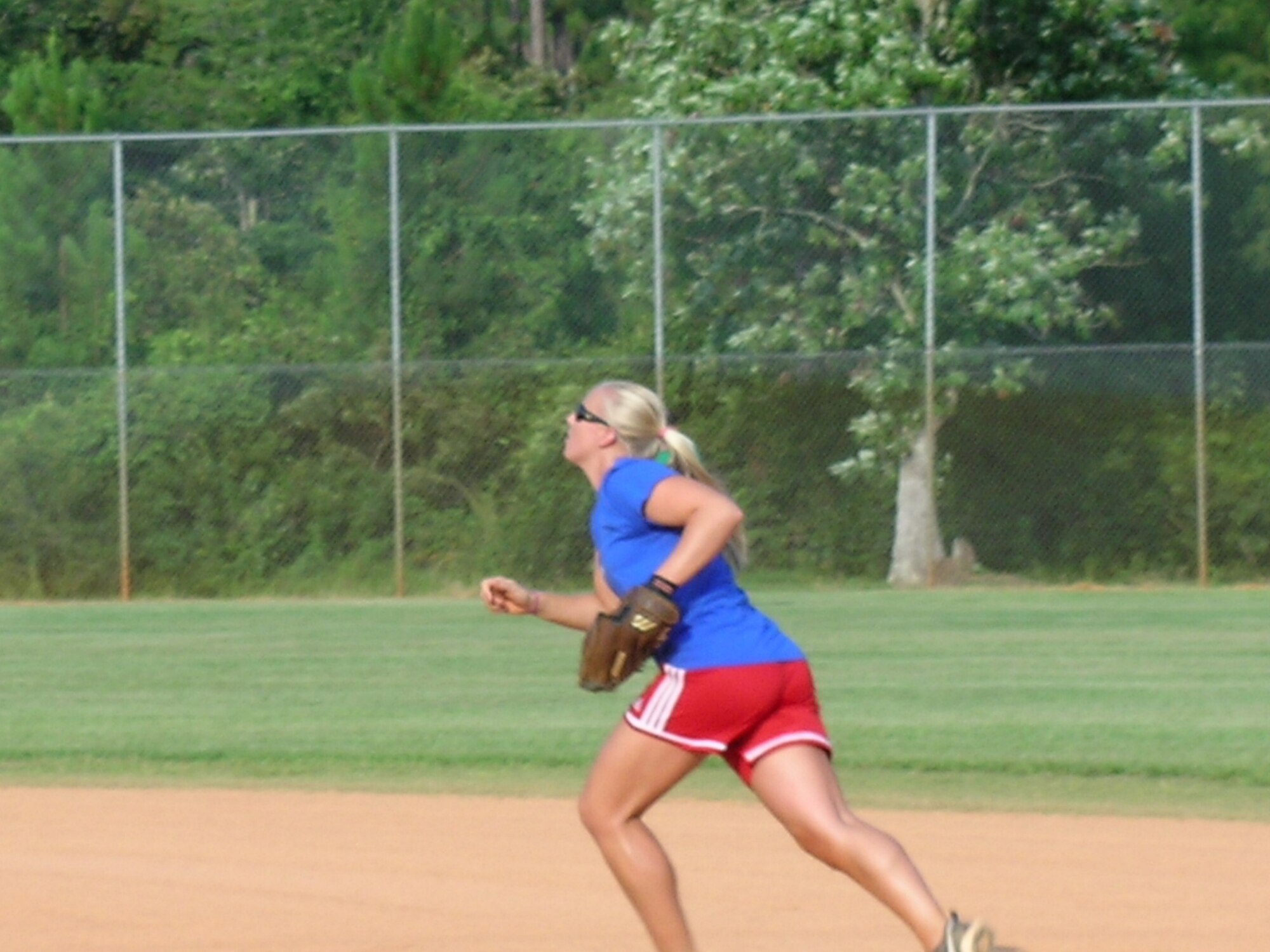 Shelby Moneer, second base for the 1st Special Operations Support Squadron, runs to field a ball Jun. 22.   The 1st SOSS lost 17-16 to the 1st Special Operations Component Maintenance Squadron in round two of the Hurlburt Field intramural softball playoffs.  The championship game takes place Jun. 25 at 5:30 behind the Aderholt Fitness Center.