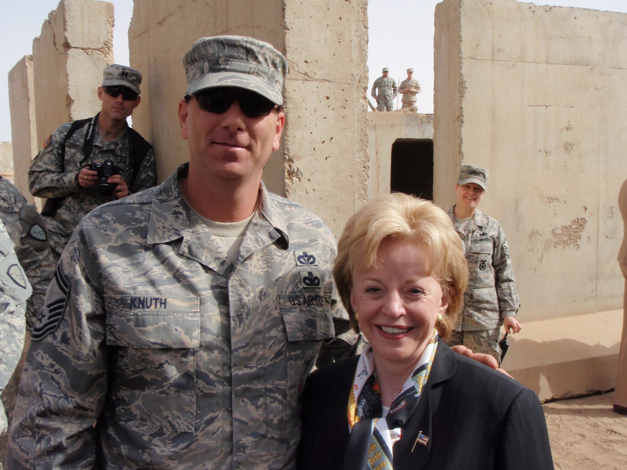 SEYMOUR JOHNSON AIR FORCE BASE, N.C. -- Senior Master Sgt. Donald Knuth poses with Mrs. Lynne Cheney during a visit to Balad, Iraq. Sergeant Knuth was recently named Air Force Reserve Command's Fire Officer of the Year.    