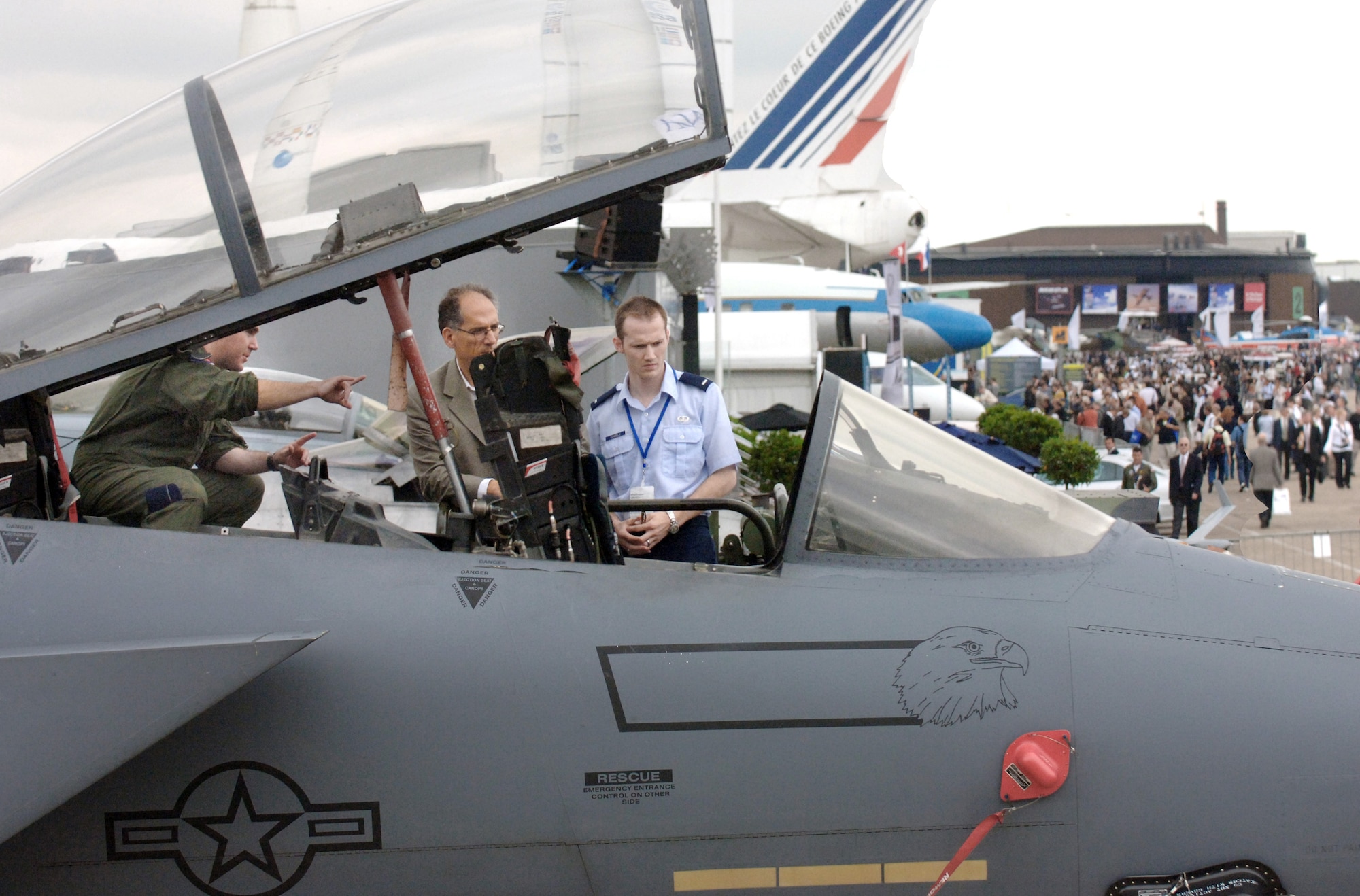 Capt. Matt Cisar gives a tour of an F-15E Strike Eagle during the Paris Air Show 2009 June 18 at Le Bourget, France. The aircraft and crew are assigned to the 492nd Fighter Squadron from Royal Air Force Lakenheath, England. Captain Cisar is an F-15E pilot. (Defense Department photo/Master Sgt. Scott Wagers) 
