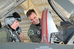 Maj. Brian Hazel, 560th Flying Training Squadron, goes over the basics of cockpit controls on a T-38 Talon with Tech. Sgt. Michael Vonahnen, 12th Security Forces Squadron, on the flightine June 24. Sergeant Vonahnen was named 2008 Team Randolph NCO of the Year and earned an incentive ride in a 12th Flying Training Wing aircraft. (U.S. Air Force photo by Don Lindsey)