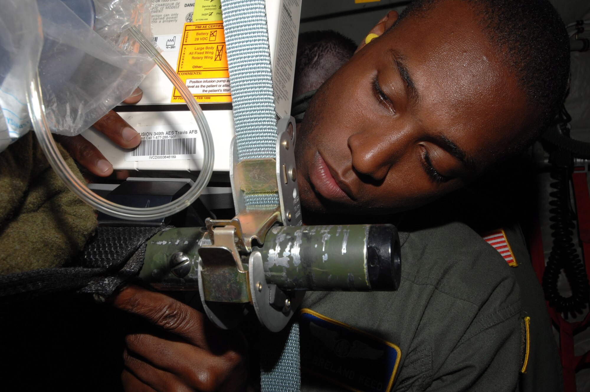 Senior Airman Breland Reed of the 349th Aeromedical Evacuation Squadron secures a Propac Encore, vital measurement device, in-flight on a C-130J Super Hercules from the 815th Airlift Squadron, Keesler Air Force Base, Miss., during Exercise Global Medic, June 12. Global Medic is a United States Army and Air Force exercise testing the readiness of medical units in a joint training environment. Incorporating both live and virtual simulation, this exercise provides realistic, battle-focused training at five locations across the United States. (U.S. Air Force photo/Senior Master Sgt. Michael Du) 