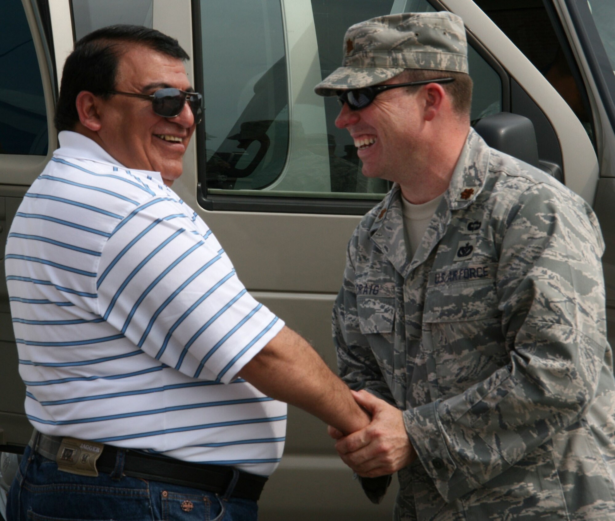 Major General Adbullah N. Nezar, the Ministry of Interior Infrastructure Director in Iraq, and Major Matthew Craig, ACC Operations Branch Chief, share a joke on Jun. 10, 2009 at Langley Air Force Base, Virginia. The Iraqi Security Forces Senior Engineer Symposium showcased how the U.S. Military conducts facilities engineering and management in order to empower Iraqi senior engineers to design, develop and execute their own plans for aiding Iraq's expanding military abilities.
