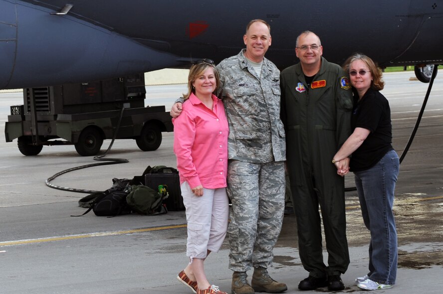 MINOT AIR FORCE BASE, ND – Chief Master Sgt. Mark Clark, 5th Bomb Wing command chief, is joined by his wife Linda,  Col. Joel Westa (left), 5th Bomb Wing commander and his wife Deborah after the chief’s final B-52H Stratofortress flight here, May 28. 