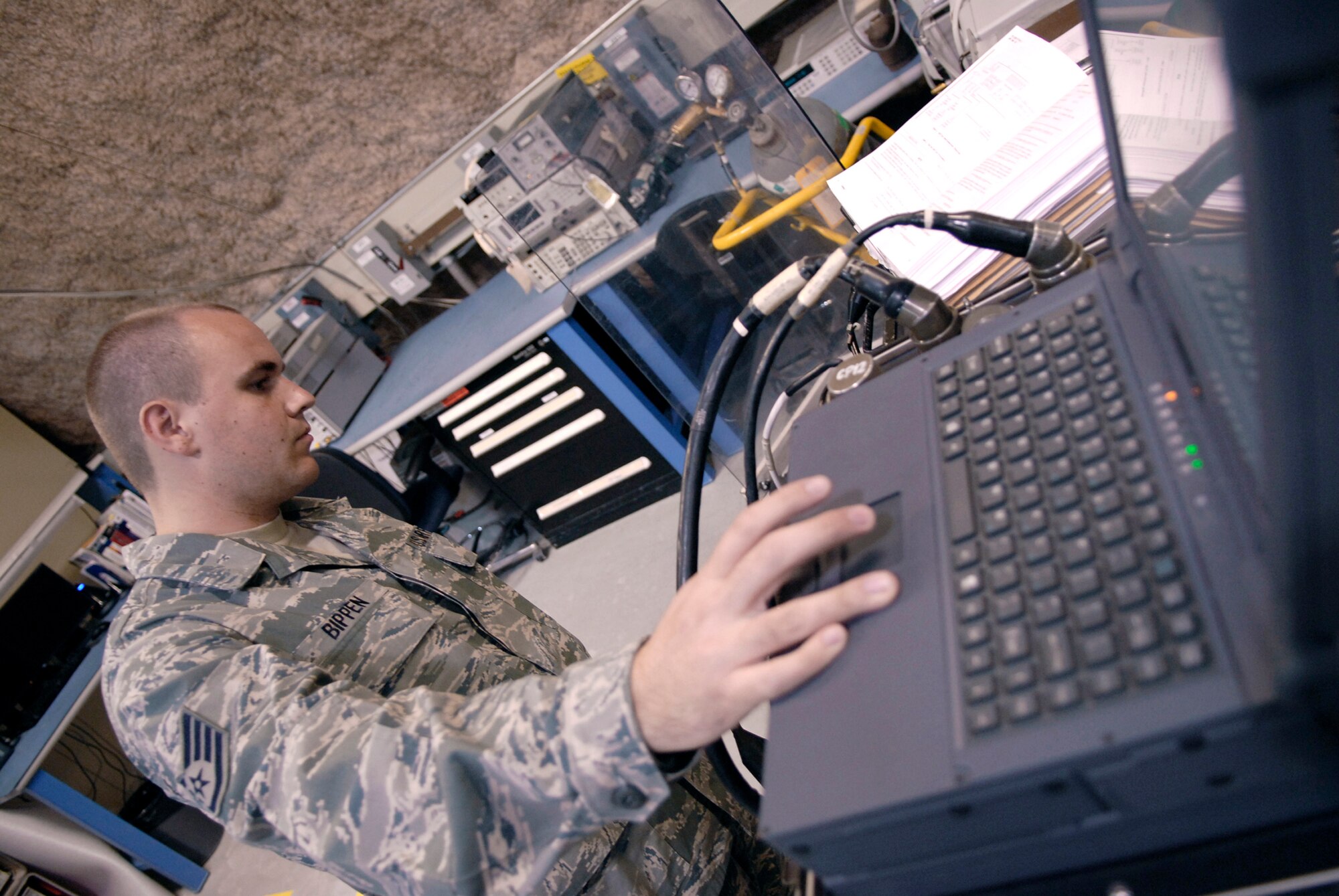 Staff Sgt. Ryan Bippen runs the self test calibration for a weapon guidance system June 15 at an air base in Southwest Asia. Sergeant Bippen ensures the equipment can run its own tests before he begins to run calibrations. Sergeant Bippen is a 379th Expeditionary Maintenance Squadron Precision Measurement Equipment Laborartory technician. He is a native of San Francisco and is deployed from Mountain Home Air Force Base, Idaho. (U.S. Air Force photo/Senior Airman Andrew Satran)