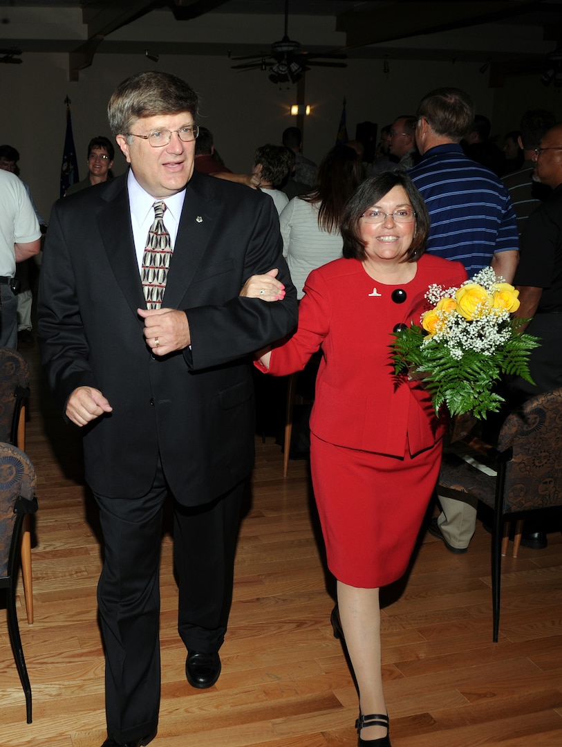Gene Boedigheimer, and his wife, Theresa, depart the 12th Communications Squadron change of leadership ceremony June 23. Mr. Boedigheimer assumed command of the squadron from Lt. Col. Donald Brown. (U.S. Air Force photo by Steve White)