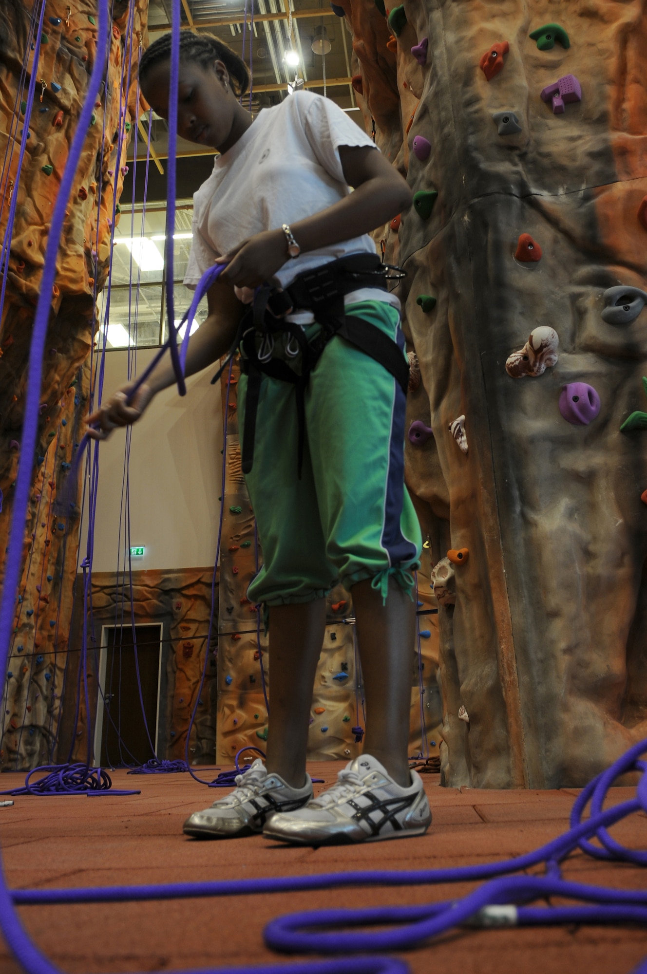 Qiara Burris, daughter of Capt. Charmaine Burris, 603rd Air Operations Center cyber operations chief, prepares to climb the rock wall at Outdoor Recreation during Basic Recreation Adventure Training camp, June 16, 2009, Ramstein Air Base, Germany. Outdoor Recreation, Romano’s Macaroni Grill, a shoppette, Ramstein Inn’s Visitor's Quarters, Ramstein Tickets and Tours, the Sports Lounge and a German bakery are all part of the first phase of openings at the Kaiserslautern Military Community Center here expected to occur in early July. (U.S. Air Force photo by Airman 1st Class Alexandria Mosness)