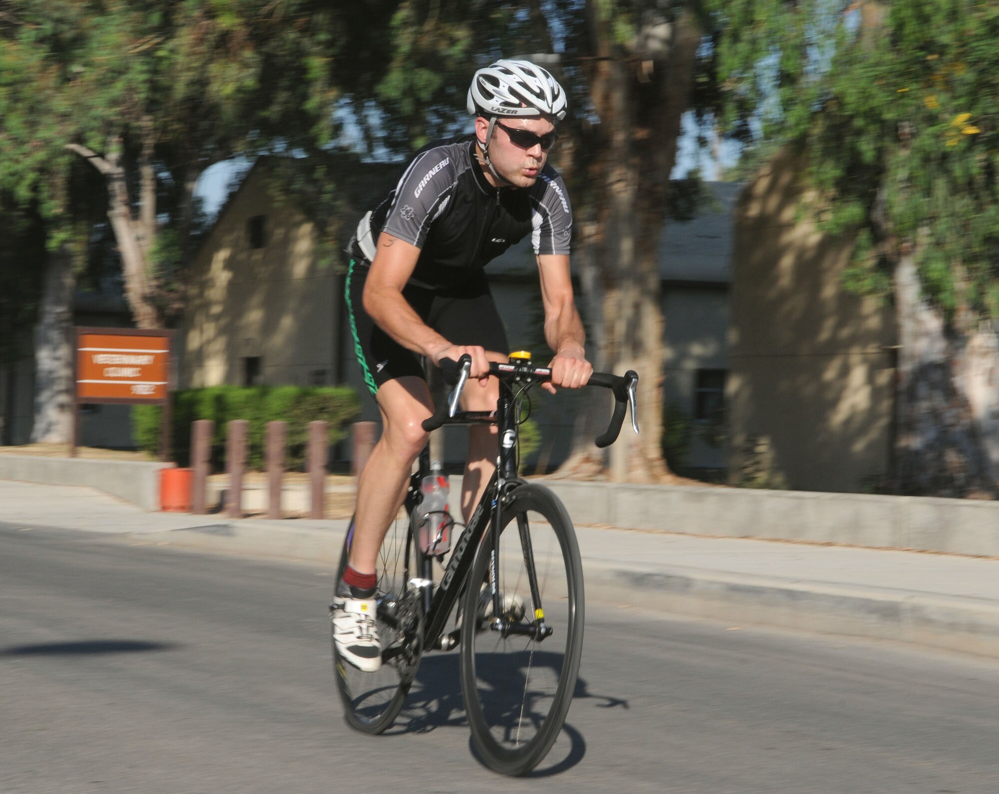Triathlon participant Brian Jankowski, 90th Expeditionary Air Refueling Squadron, begins the biking portion of the Sprint Triathlon Saturday, June 20, 2009 at Incirlik Air Base, Turkey. Thirty eight Airmen, civilians and family members participated in the competition. The triathlon added a twist to classic triathlons because the order of events was run, bike and swim instead of the classic swim, bike and run. (U.S. Air Force photo/Senior Airman Alex Martinez)