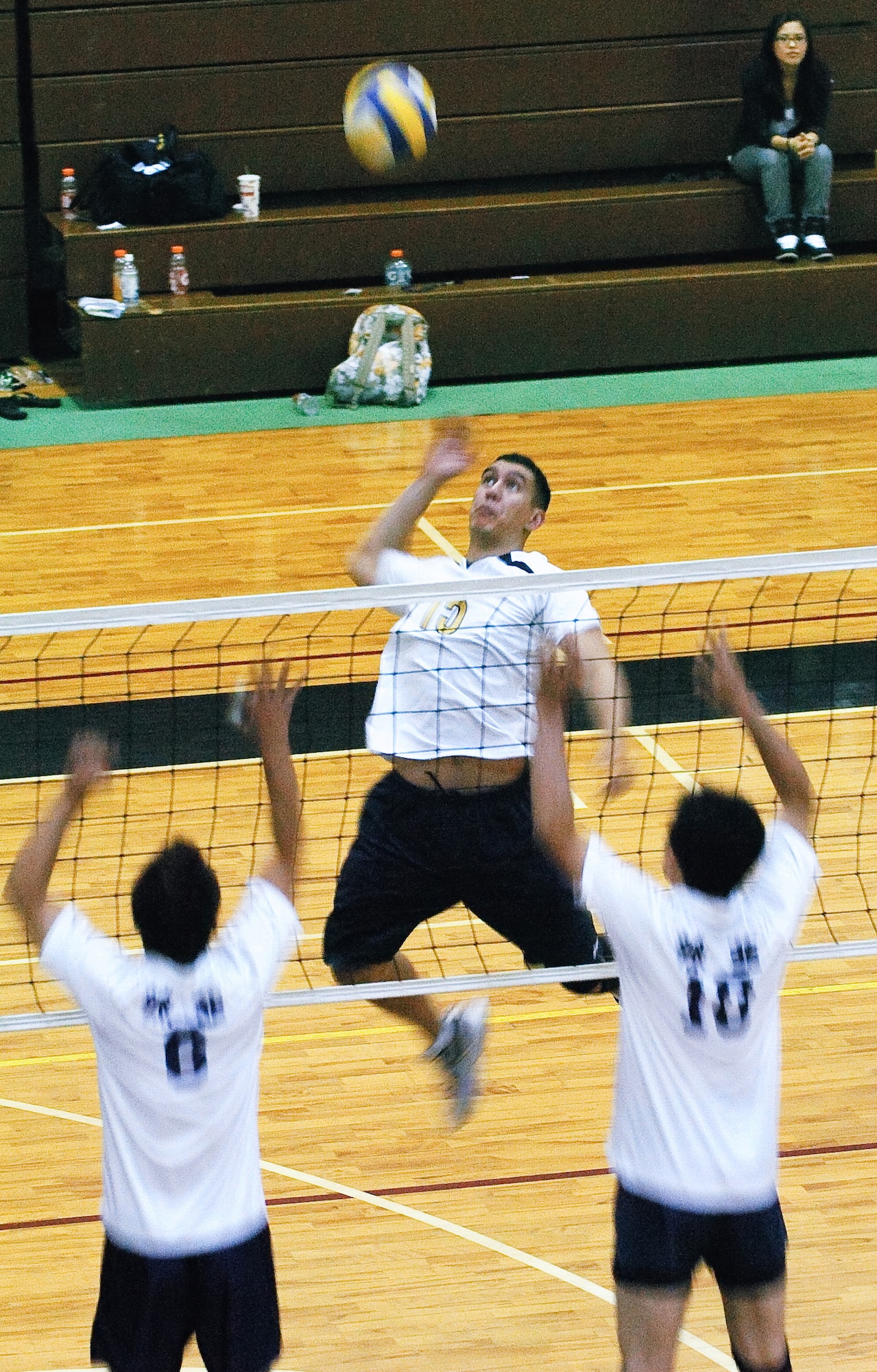 YOKOTA AIR BASE, Japan -- James Dela-Pena (No. 15) brings the thunder against an unsuccessful double block by the Japanese squad Rakkyo June 21 during the championship match of the Kanto Volleyball Invitational Tournament at the Samurai Fitness Center here. The Yokota Warriors won the mens' division of the tournament with a straight-set victory over Rakkyo. The Yokota Warriors womens' team took second, losing in the finale to Link, a local Japanese squad. (U.S. Air Force photo/Master Sgt. Matt Summers)   