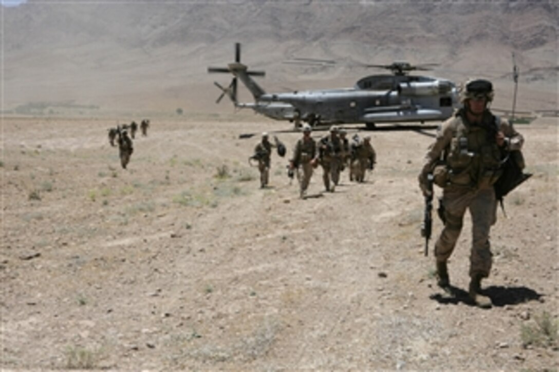U.S. Marines with 2nd Battalion, 3rd Marine Regiment (Reinforced) arrive at their forward operating base after holding key terrain within a hostile mountain pass in the Farah province of Afghanistan on June 16, 2009.  The Marines are the ground combat element of Regimental Combat Team 3, whose presence prevents enemy movement in an effort to maintain peace for the local populace.  