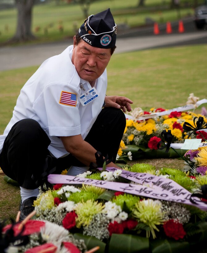 A Republic of Korea veteran arranges a wreath during the Korean War Memorial at the National Memorial Cemetery of the Pacific June 25. Hawaii lost more service members per capita in the Korean War than any other state. (Official U.S. Marine Corps photo by Lance Cpl. Achilles Tsantarliotis)(Released)