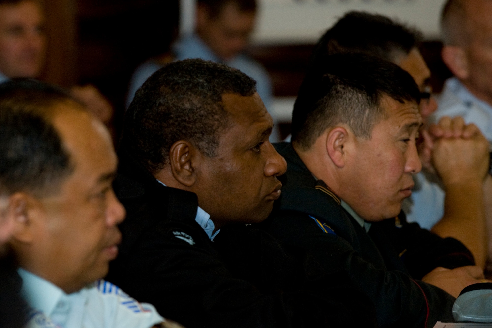 Warrant Officer Arua Ikupu of the Papua New Guinea Defence Force (center) listens to a presentation during the Senior Enlisted Leadership Conference in Wellington, New Zealand, June 24.  The conference, co-hosted by the RNZAF and U.S. Air Force, gathered senior enlisted leaders from air forces throughout the Asia-Pacific region June 23-27. (New Zealand Defence Force photo/LAC Rachael Park)
