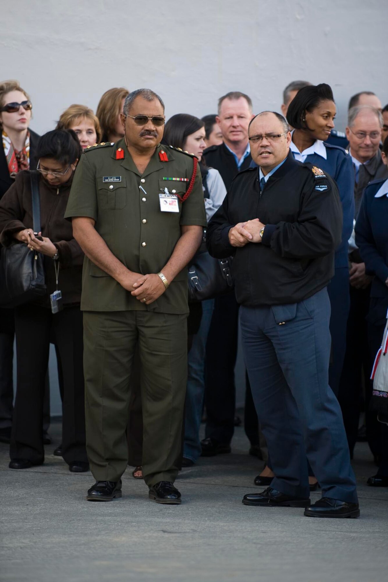 Tonga Defense Services Col. Siamelie Latu, left, prepares to accect the rautapu, a small token placed on the ground by Maori warriors during a traditional welcoming ceremony, in Wellington, New Zealand, June 23.  By accepting the rautapu, visitors indicate they come in peace.  Colonel Latu and representatives from 18 other Asia-Pacific nations were taking part in the Pacific Rim Airpower Symposium and Senior Enlisted Leadership Conference June 23-27, aimed at improving cooperation and interoperability between regional air forces.  (New Zealand Defence Force photo/LAC Rachael Park)