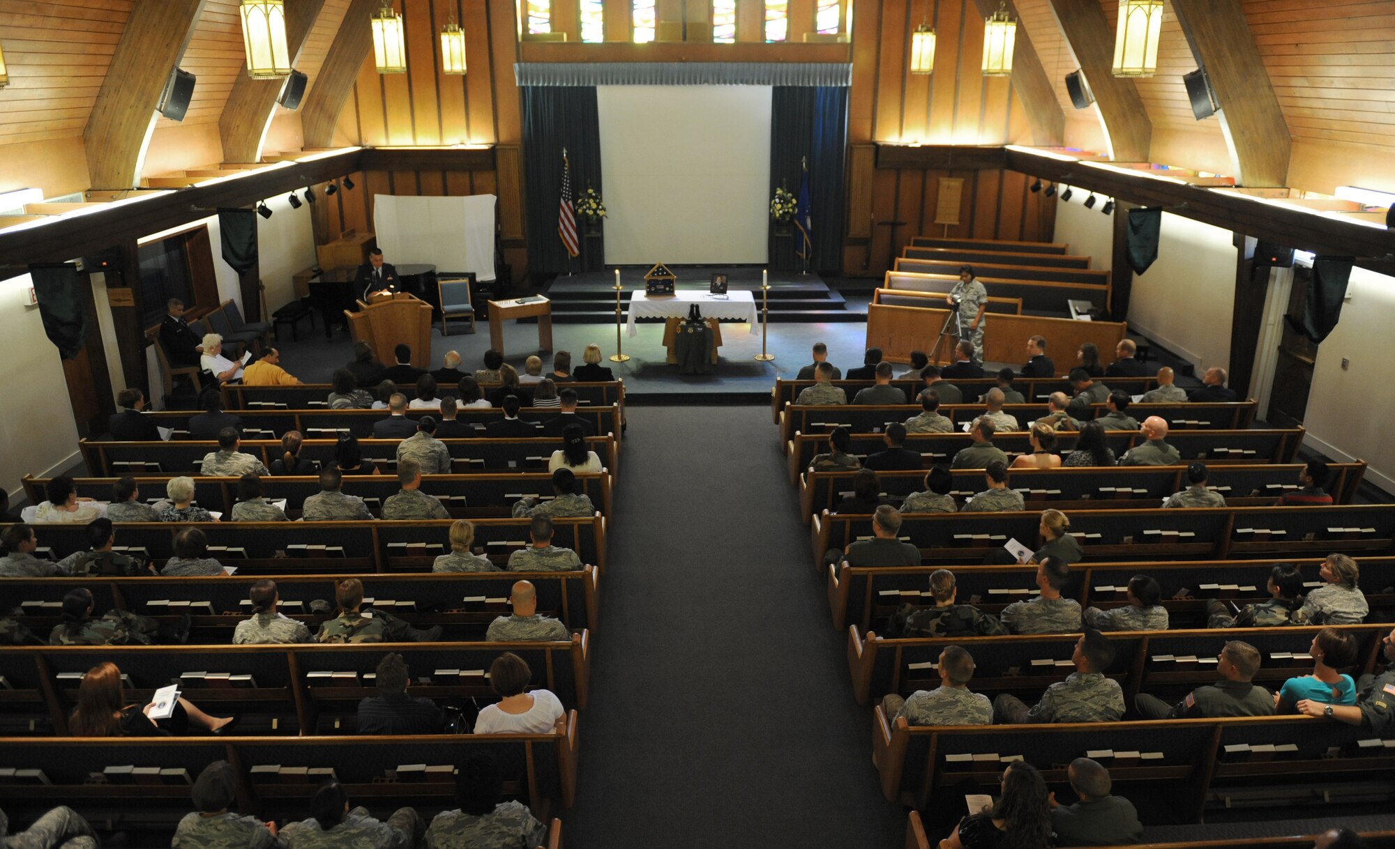 Family and friends of Lt. Col. H. Robert Prager, listens to words of remembrance by unit members during a special memorial ceremony honoring Lt. Col. Prager at the base chapel, Nellis Air Force Base, Nev., June 23. Lt. Col. Prager was a flight surgeon assigned to the 99th Medical Group and was laid to rest with full military honors.
(U.S. Air Force Photo/Senior Airman Larry E. Reid Jr.)