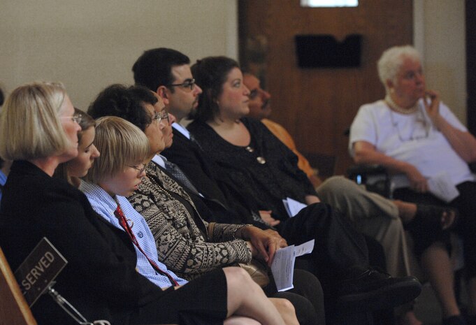 Family members of Lt. Col. H. Robert Prager, listens to words of remembrance by unit members during a special memorial ceremony honoring Lt. Col. Prager at the base chapel, Nellis Air Force Base, Nev., June 23. Lt. Col. Prager was a flight surgeon assigned to the 99th Medical Group and was laid to rest with full military honors.(U.S. Air Force Photo/Senior Airman Larry E. Reid Jr.)