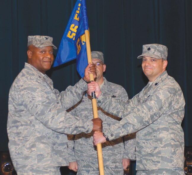 Lt. Col. David Hillman accepts command of the 56th Communications Squadron from Col. Andre Curry, 56th Mission Support Group commander, Monday at the Desert Star Club. (U.S. Air Force photo/ Airman 1st Class Sandra Welch )