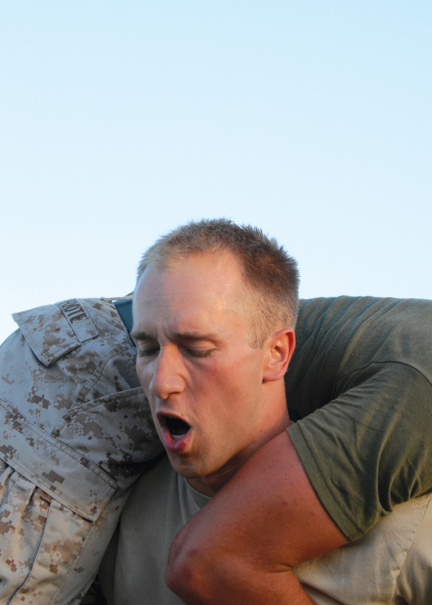 Senior Airman Mitchell Bechtold, 56th Civil Engineer Squadron readiness and emergency manager, does squats while holding a teammate across his back to add resistance. (U.S. Air Force photo/ Airman 1st Class Sandra Welch)