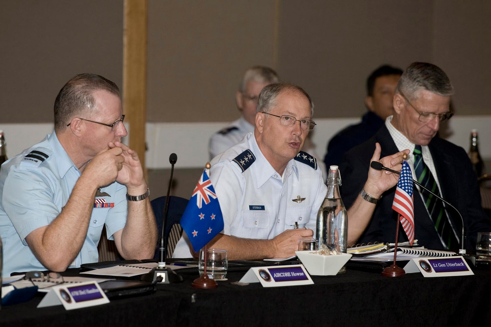 New Zealand Air Commodore Gavin House (left to right), Lt. Gen. Chip Utterback and retired Marine Lt. Gen. John Goodman discuss humanitarian assistance with senior officers from 17 other Asia-Pacific nations during the Pacific Rim Airpower Symposium June 24 in Wellington, New Zealand. Air Commodore House is the Joint Forces New Zealand air component commander. General Utterback is the 13th Air Force commander at Hickam Air Force Base, Hawaii. General Goodman is the director of the Center for Excellence in Disaster Management and Humanitarian Assistance at the Tripler Army Medical Center, Hawaii. (Courtesy photo) 
