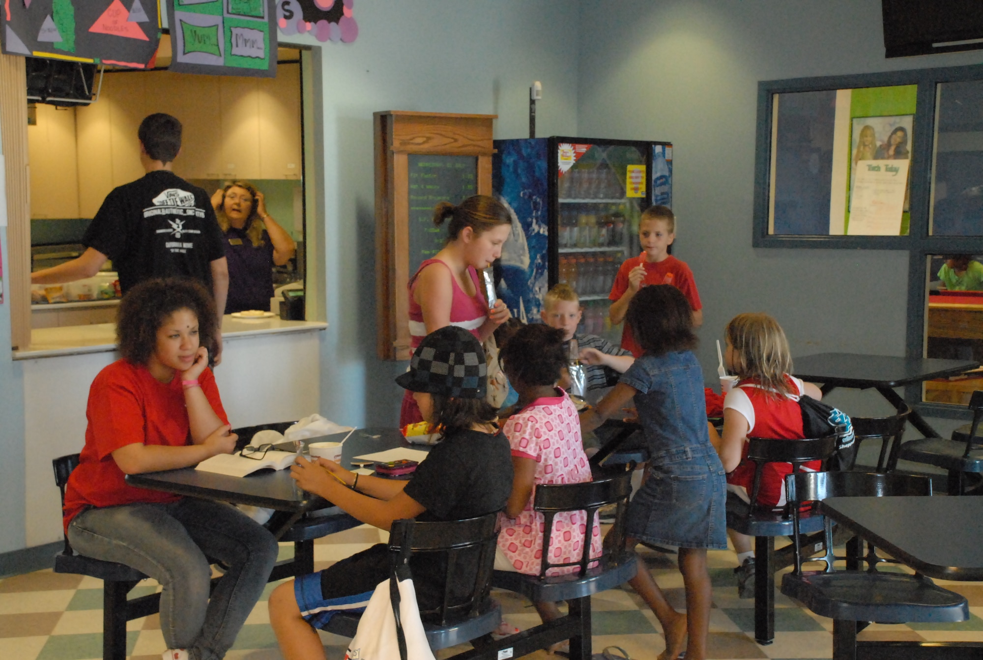 Youth Center workers and attendees enjoy a snack break in between activities June 25 at the Youth Center. Each day Beale's youth encounter a full schedule of educational and recreational activities. (Photo by Airman 1st Class Chuck Broadway)