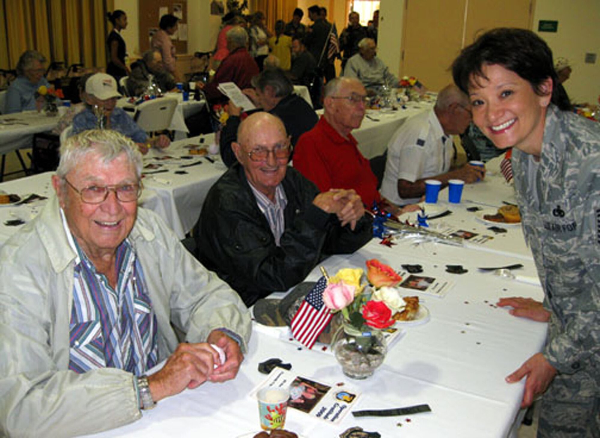 TRAVIS AIR FORCE BASE, Calif. -- Senior Master Sgt. Darlene Chaboude, 349th Air Mobility Wing, visits with veterans during Operation Gratitude June 20, 2009. A large group of reservists from the wing go to the California Veterans Home, Yountville, yearly, to set up and serve a champagne brunch to the veterans as a way of saying "Thank you for your service to America." Read the full story in the August issue of the Contact magazine. (U.S. Air Force photo/Senior Master Sgt. Ellen Hatfield)