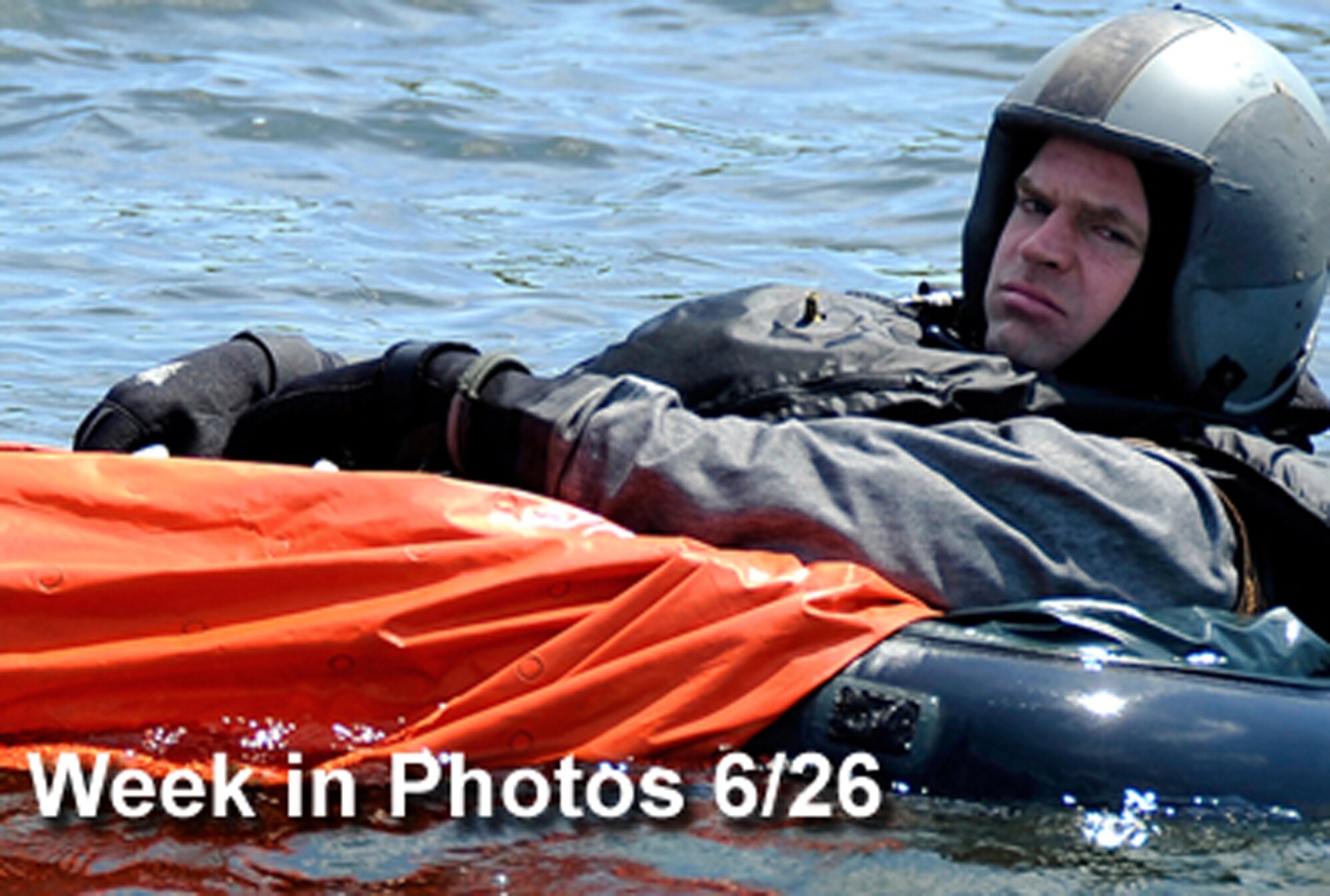 Air Force Week in Photos for June 26 highlights photos from around the Air Force. In this photo by Senior Airman Chad C. Strohmeyer, Maj. Wesley Hales awaits "rescue" during water survival training June 24 at Lake Ogawara near Misawa Air Base, Japan. (U.S. Air Force illustration)
